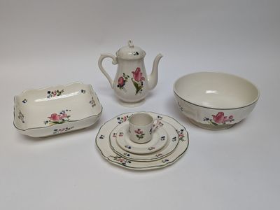 four pieces of china on a white table