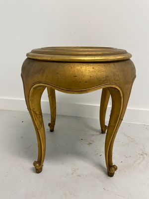 an image of a small brass table with a wooden top