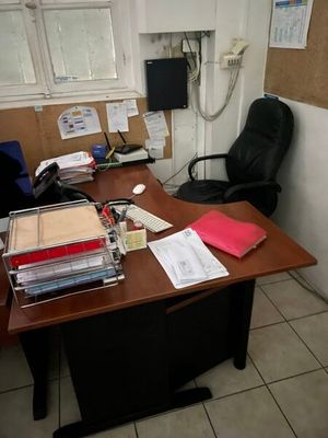 a desk with a lot of papers on it