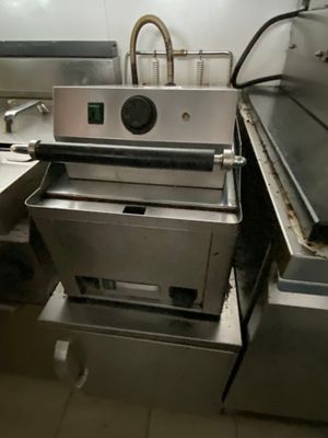 an image of a commercial kitchen with stainless steel appliances