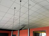 three lights hanging from the ceiling in a room
