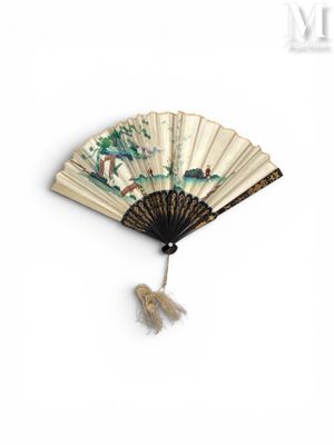 un ventilateur avec un tableau accroché au mur