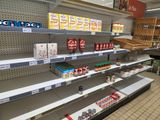 many shelves in the store that have food items on them