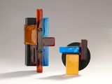two pieces of art that are sitting on a table