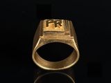 an image of a gold ring with a cross on it
