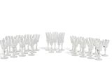 a lot of wine glasses that are sitting on the table