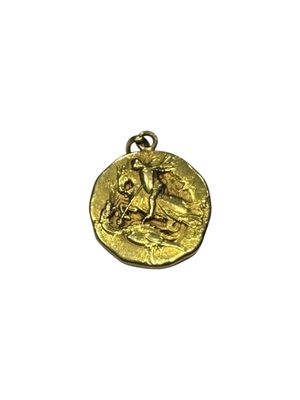 a gold coin with a woman sitting on top of it