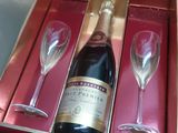 a bottle of wine and two wine glasses in a box