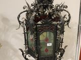 a glass display case with a clock inside of it