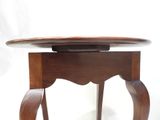 a wooden table with a glass top on a white background