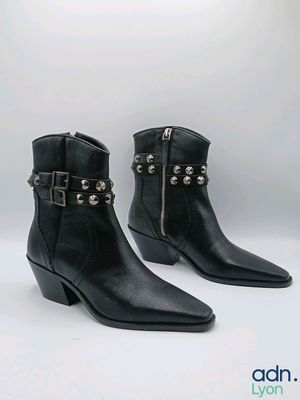 black leather ankle boots with studded straps and buckles