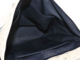 the inside of a purse with a white glove on top of it