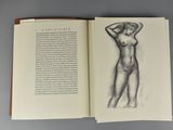 a book with a drawing of a nude woman on it