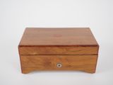 an image of a small wooden box on a white surface