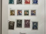 an open book with a picture of a number of stamps on it