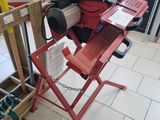 a picture of a red work bench with tools on it