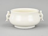 an image of a white bowl with handles on a gray surface