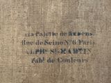 an old book with writing on it sitting on top of a table