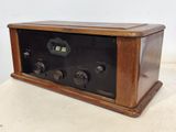 an old radio that is sitting on a table