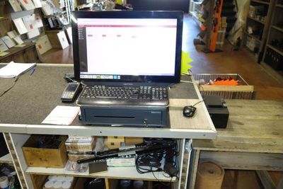 a laptop computer sitting on top of a wooden table
