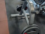 a row of exercise equipment in a gym room