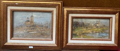 deux tableaux posés sur une table à côté d'un vase de fleurs