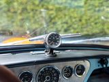 a dashboard of a car with a clock on it