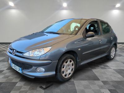 a picture of a blue car parked in a garage
