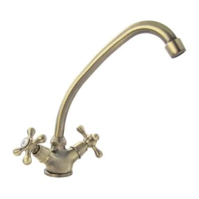 an image of a faucet with a brass finish on a white background