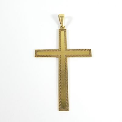 a gold cross pendant on a white background
