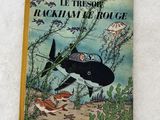 un vieux livre pour enfants avec une illustration représentant un requin et un crabe