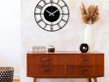a clock on the wall above a dresser in a living room
