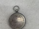 an image of a silver pocket watch with a chain around it