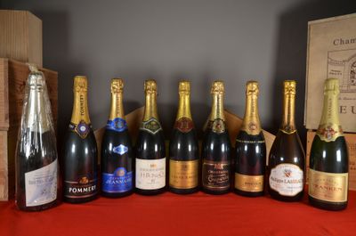 several bottles of wine are lined up on a table