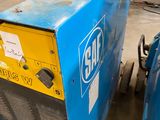 an image of a couple of welding machines sitting in a warehouse