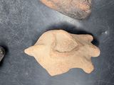 three rocks on the table next to each other