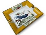 a close up of a plate with a bird on it