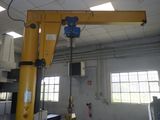 a large yellow crane that is in a building