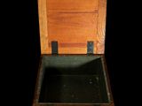 a small wooden box with writing on it