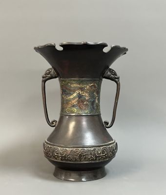 a metal vase with a handle on a white background