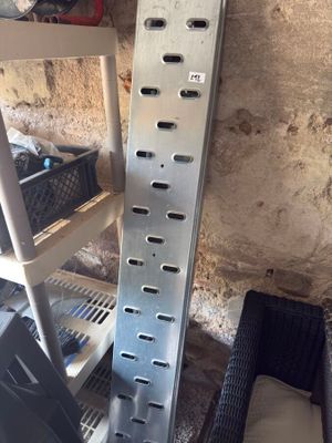 a picture of a metal shelf with a bunch of items