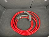 a red hose in the trunk of a car