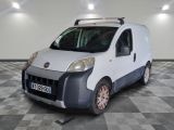 a white van that is parked on a checkered floor
