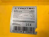 the back end of a yellow tractor with a barcode on it