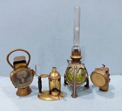 four different types of antique brass objects on a table