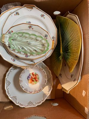 a box with a bunch of plates and a fan in it