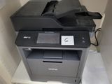 a printer that is sitting on top of a shelf