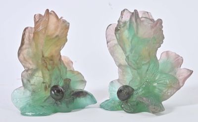 two figurines that are sitting next to each other