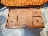a wooden box that has six drawers inside of it