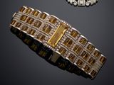 two gold and diamond bracelets and a broochet broochet